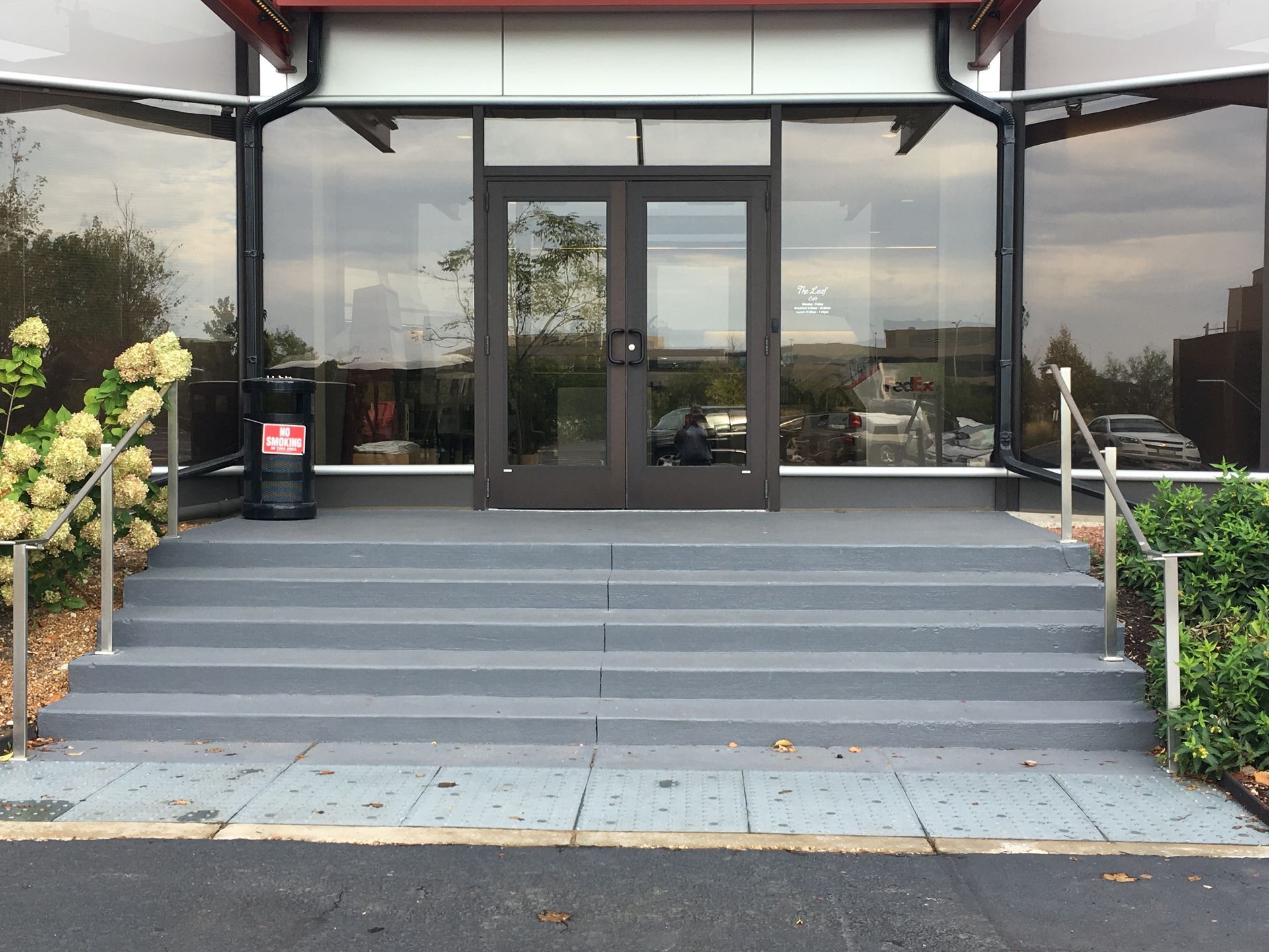 a building with a trash can in front of it