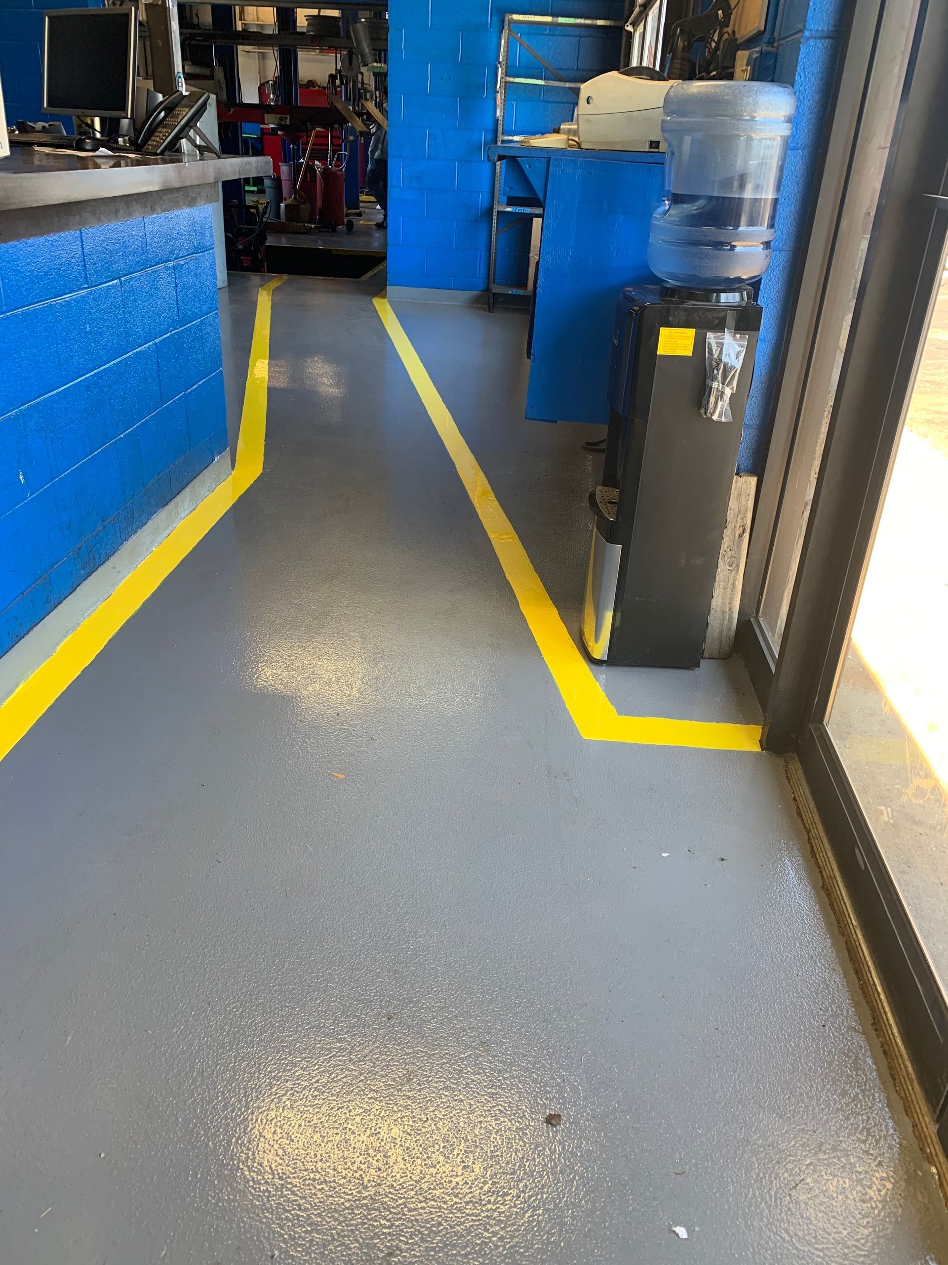 a yellow line is painted on the floor of a building