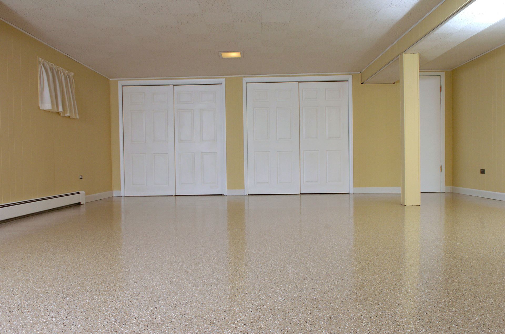 an empty basement with sliding doors and a sign that says ny