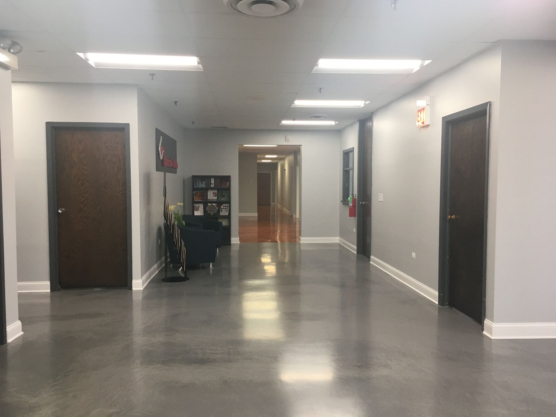 a long hallway in a building with a lot of doors
