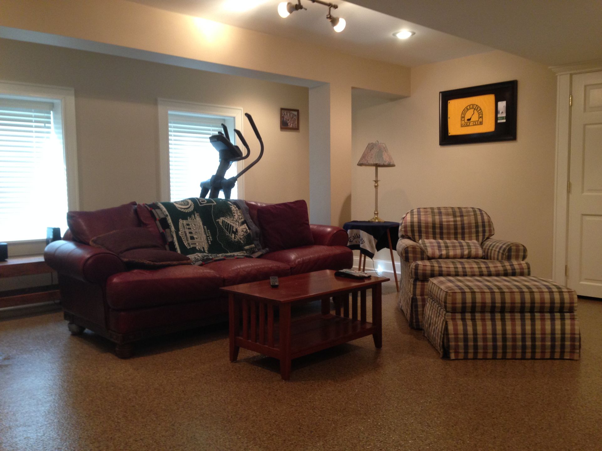 a living room with a couch a chair and a coffee table