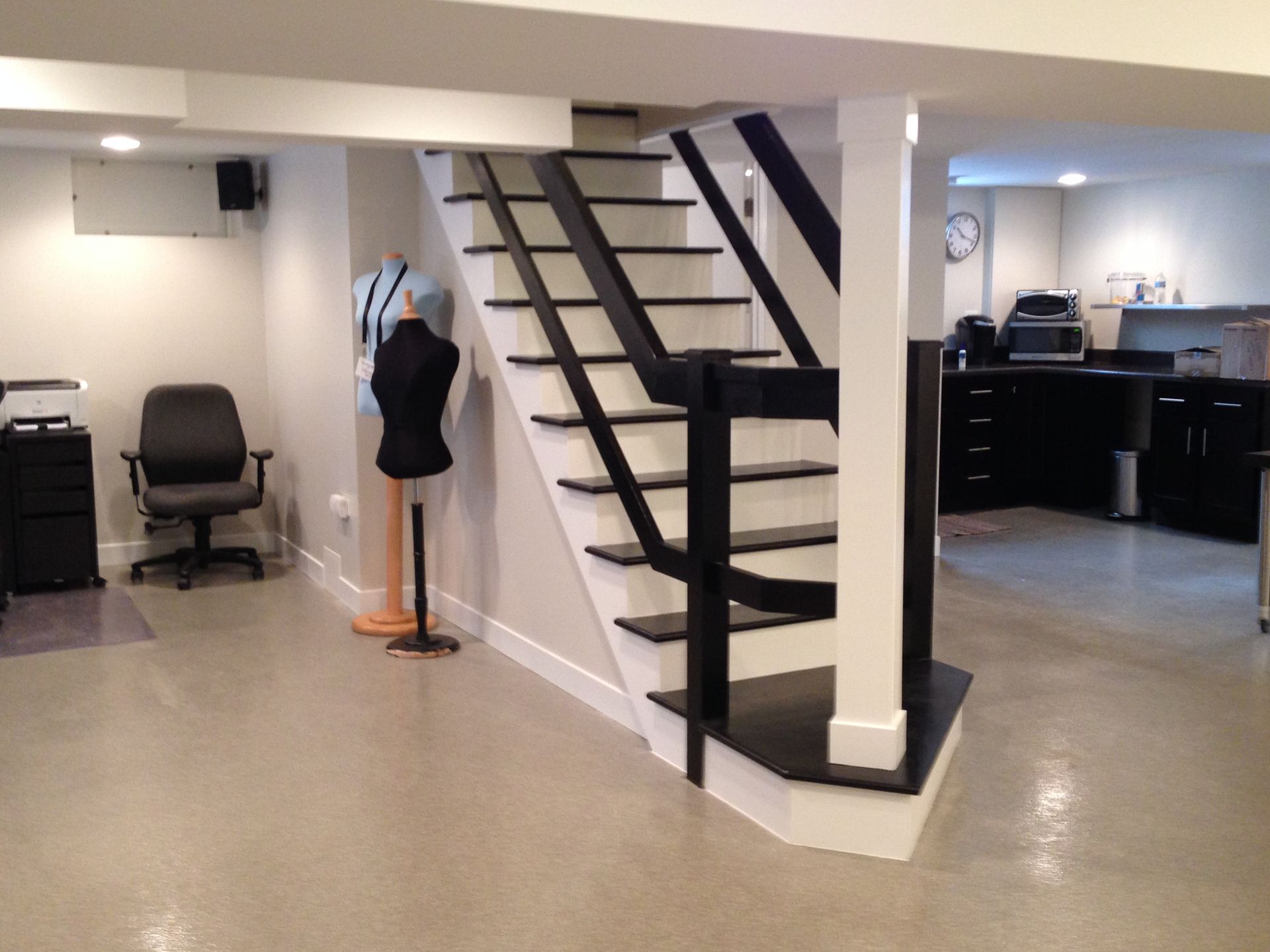 a black and white staircase in a basement