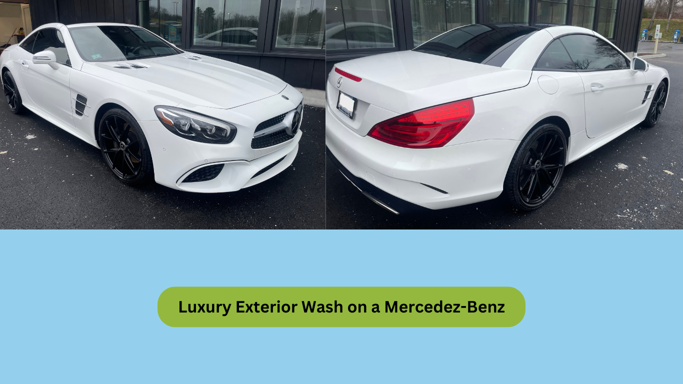A white mercedes benz is parked in front of a building.