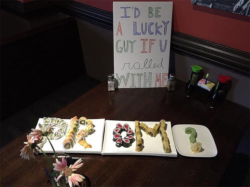 A sign that says i 'd be a lucky guy if u rolled with me