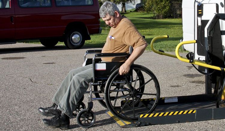 handicapped person backing his wheelchair