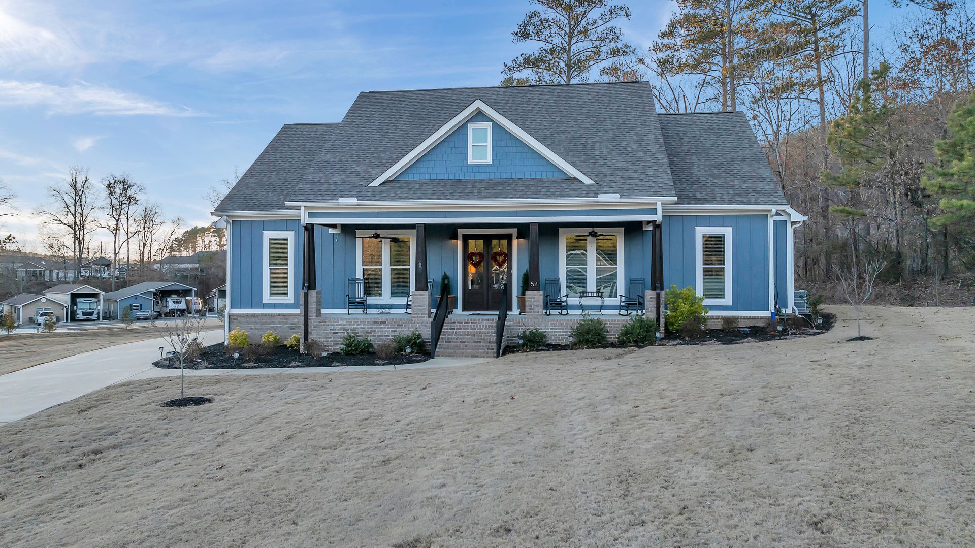 A blue house with a gray roof