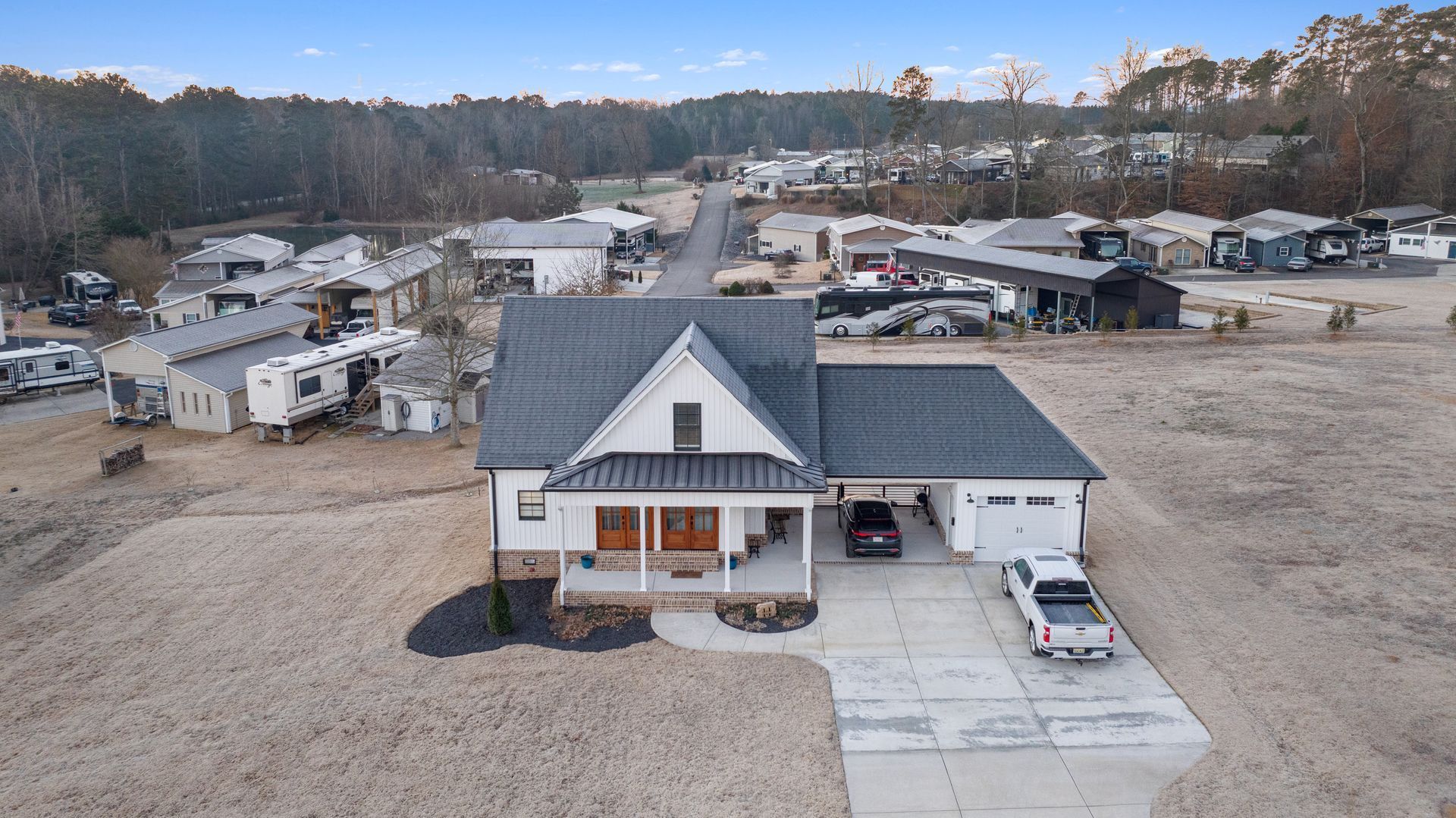 An aerial view of a house with a car parked in front of it.