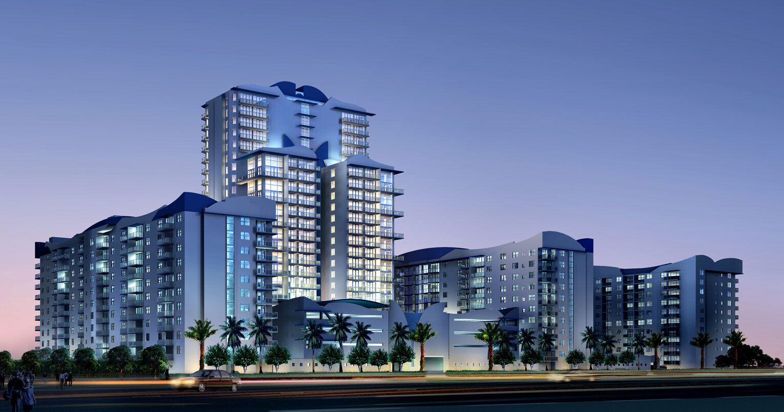 A large building with a lot of windows is lit up at night