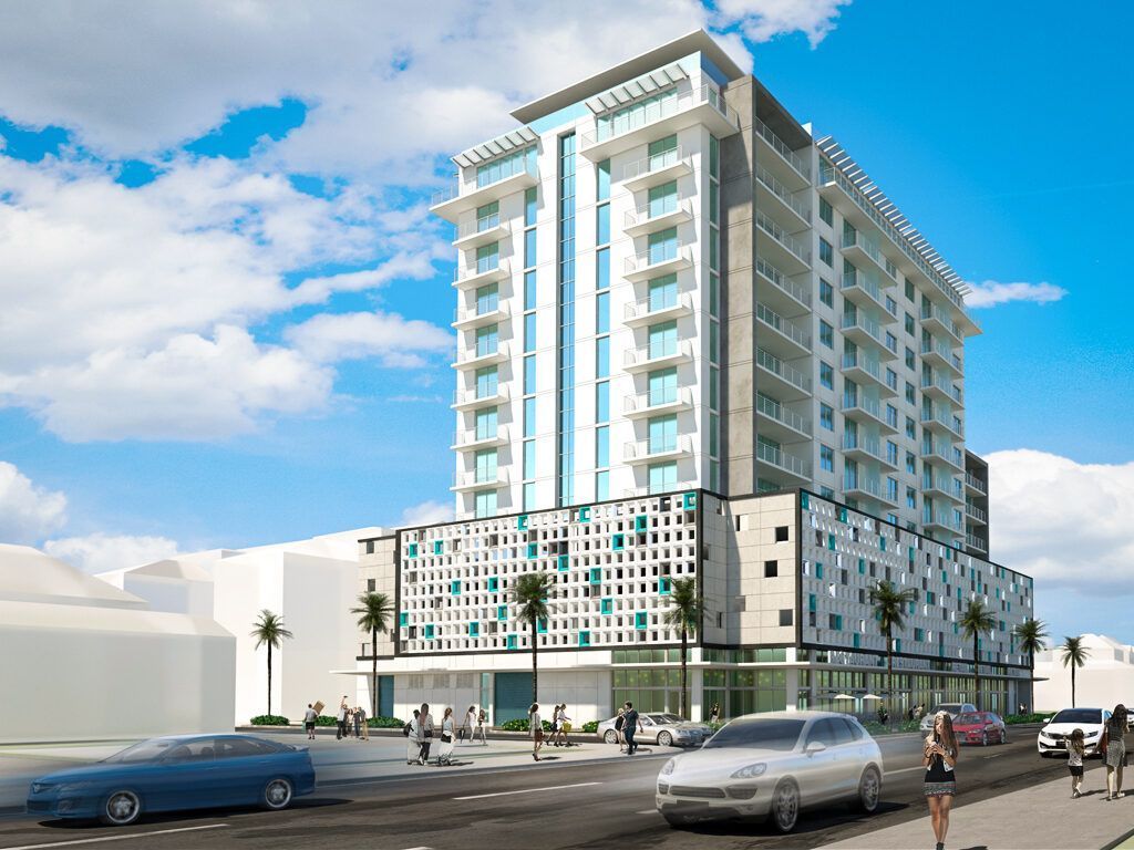 A tall building with cars parked in front of it