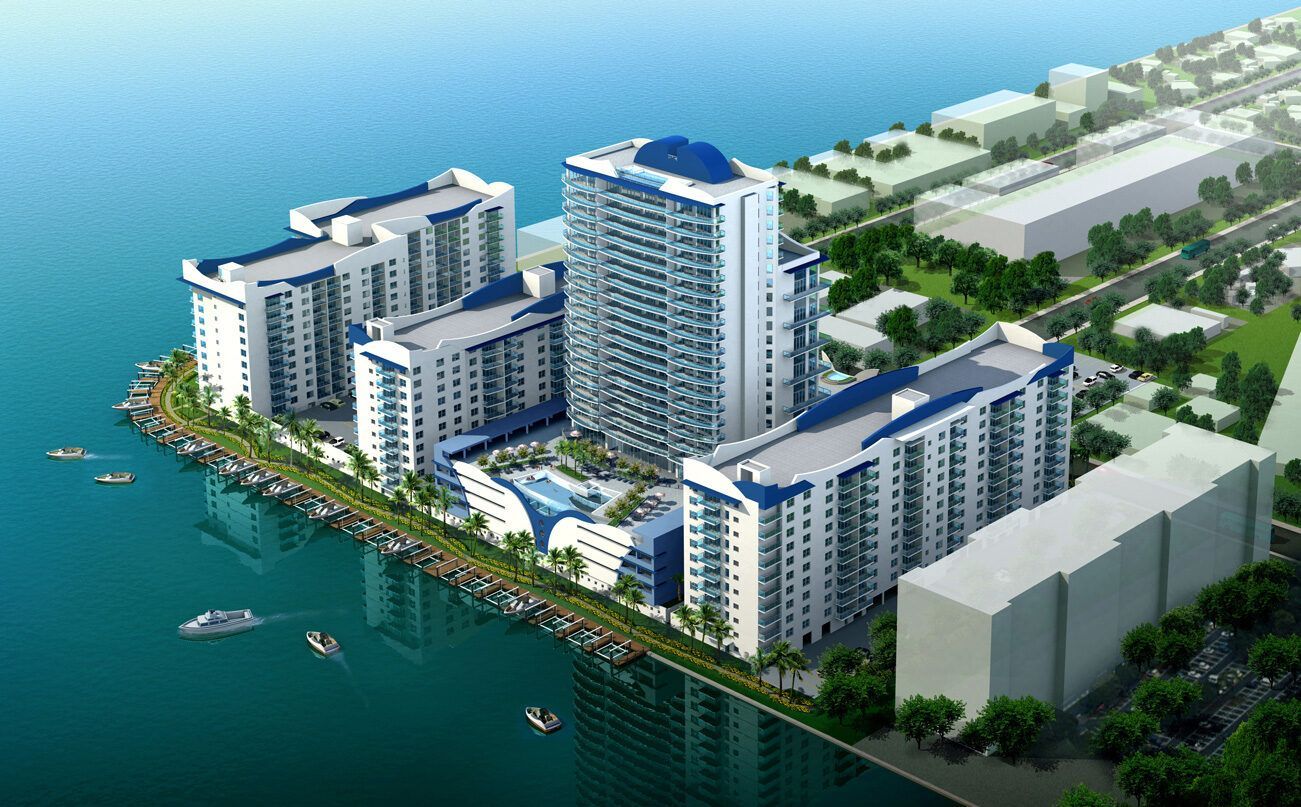 An aerial view of a city surrounded by water and buildings