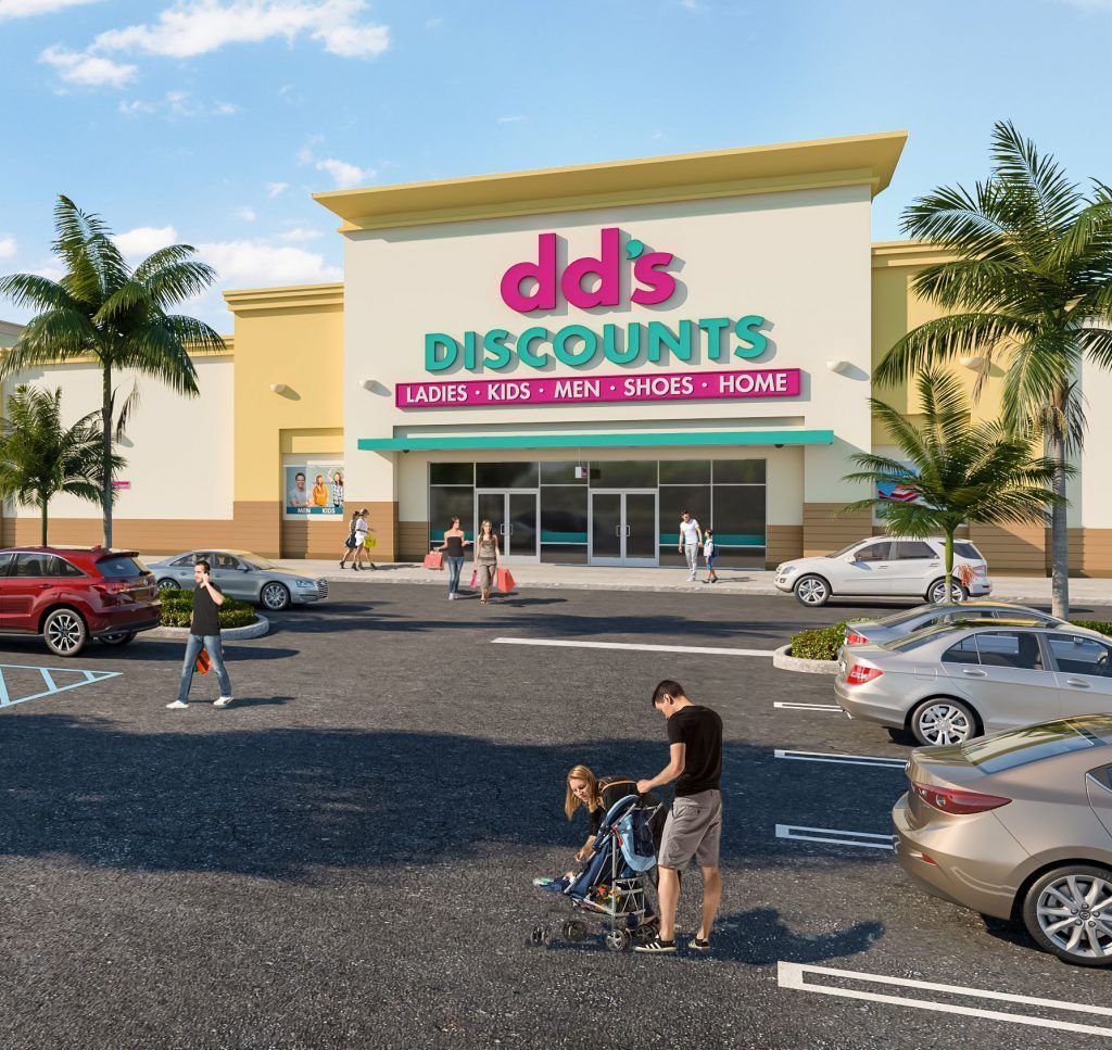 Dds DISCOUNTS store exterior with shoppers in parking lot.