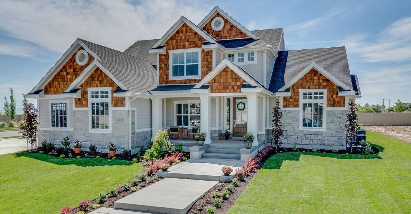 A large house with a large lawn in front of it
