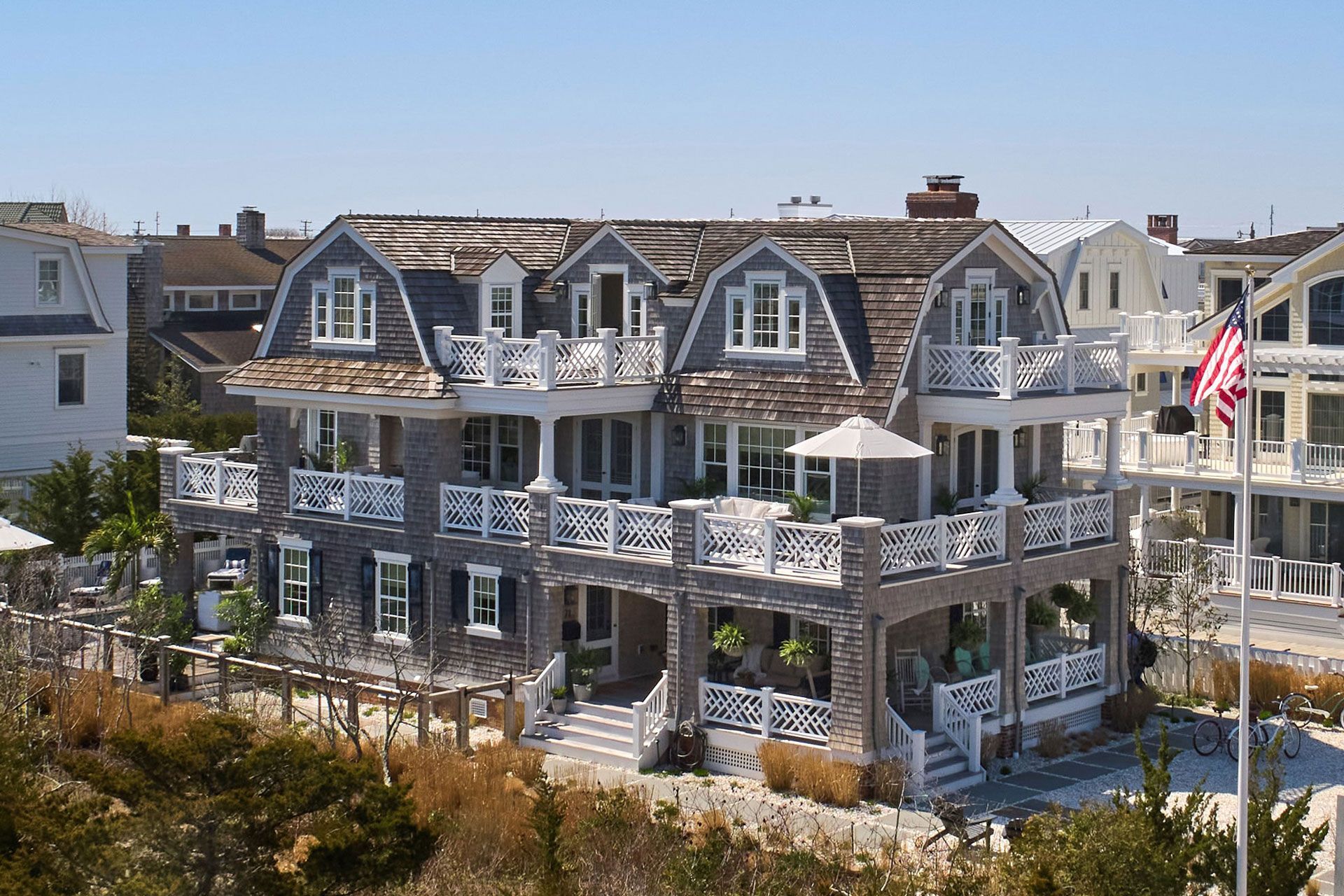 A large house with a flag in front of it