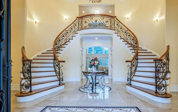 There is a large staircase in the middle of the room.