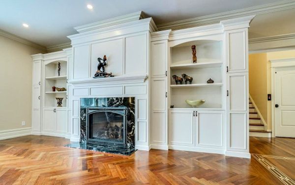 There is a fireplace in the middle of the room.