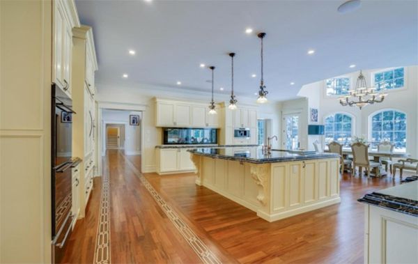 A large kitchen with a large island in the middle