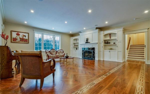 A living room with hardwood floors and a fireplace
