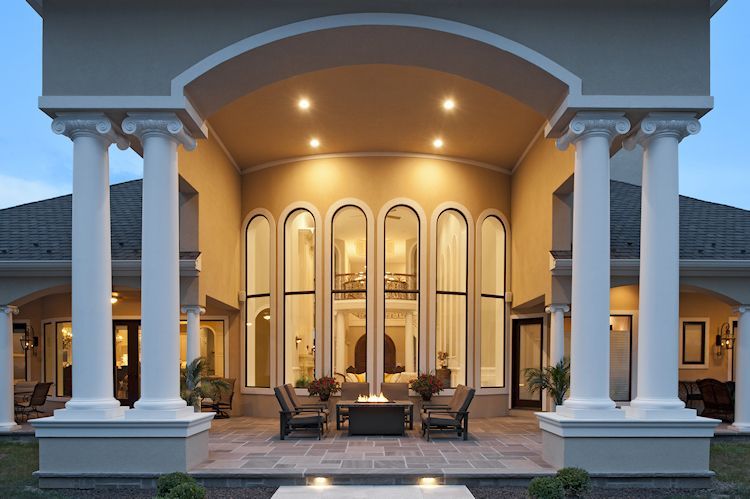 A large house with columns and arched windows