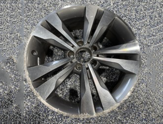 Gray alloy car wheel with multi-spoke design.