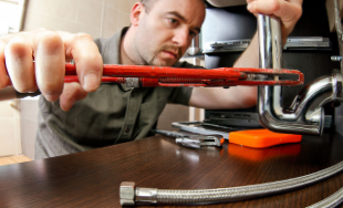 Plumber repairing pipes