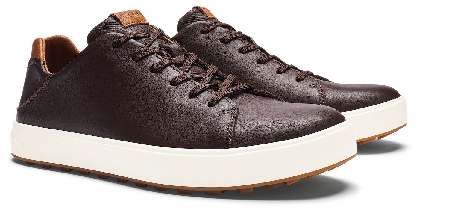 Brown leather sneakers with white soles.