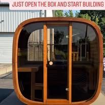 Wooden barrel-shaped structure with glass front and door, the caption says 