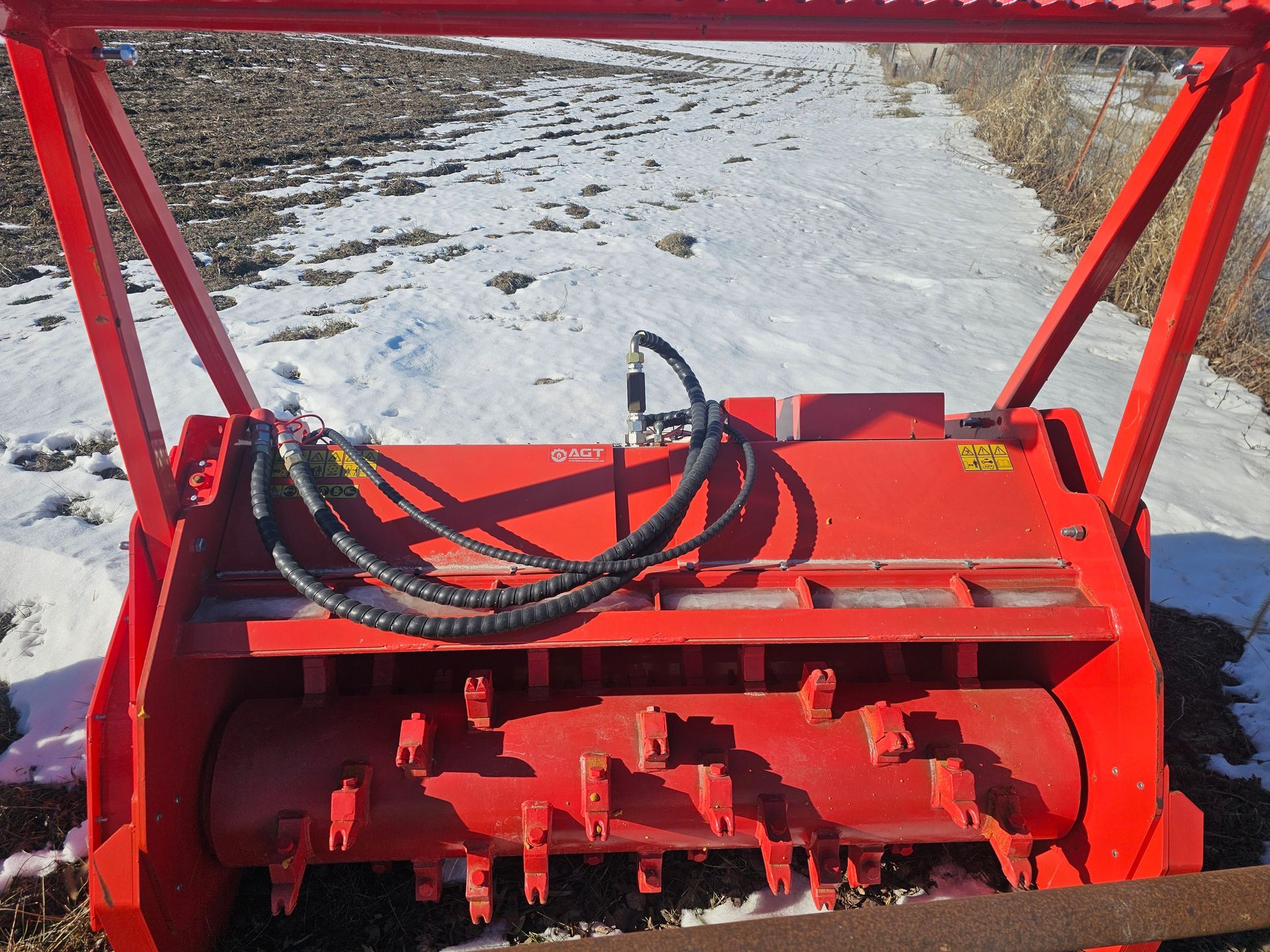 A red machine with a hose attached to it