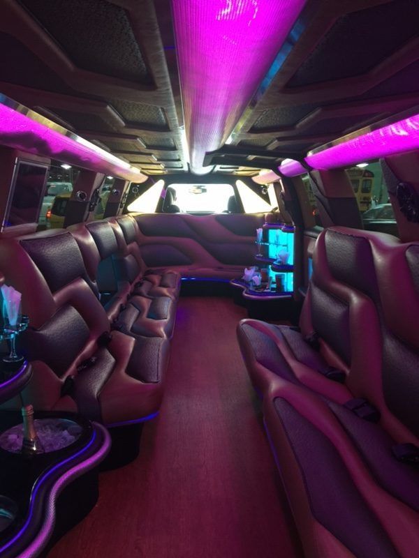 the inside of a limousine with a pole in the middle of the room .