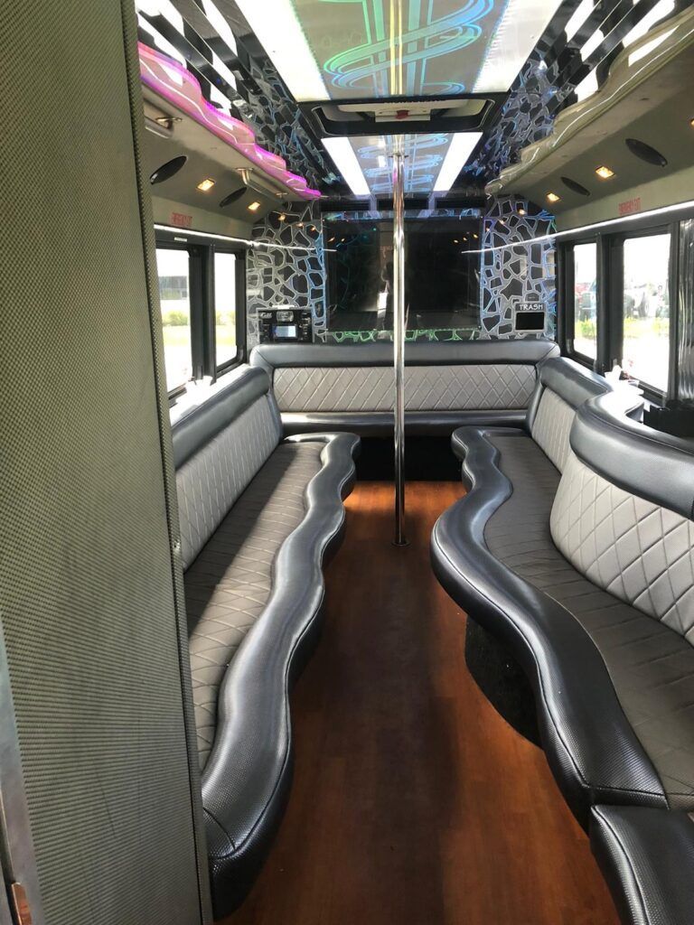 the inside of a limousine with a pole in the middle of the room .