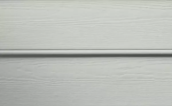 Light gray wooden siding with a horizontal groove.