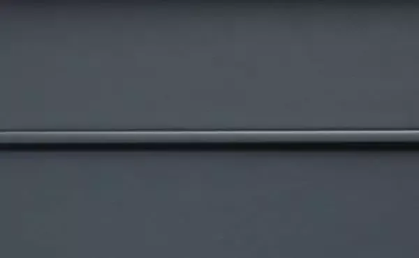 Gray wall with horizontal, raised dark gray strip.