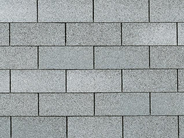 Gray brick wall with staggered horizontal rows.