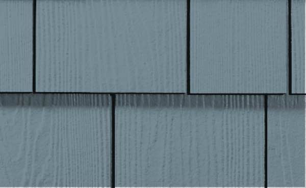 Blue-gray siding with rectangular, textured panels separated by dark lines.