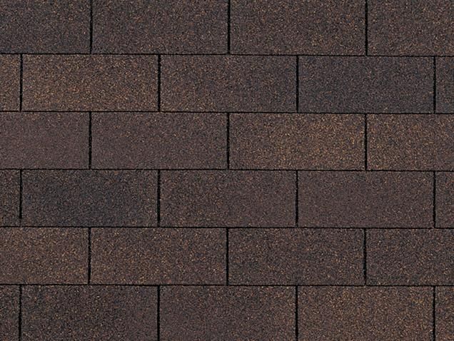 Brown asphalt roof shingles in a brick pattern.