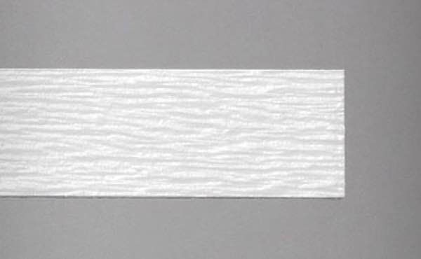 White textured wall molding against a gray background.