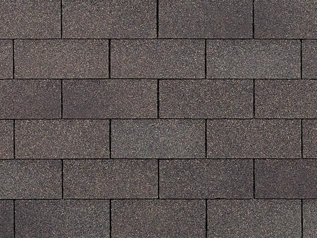 Dark brown asphalt roof shingles in a brickwork pattern.