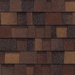 Brown and tan asphalt roof shingles in a staggered pattern.