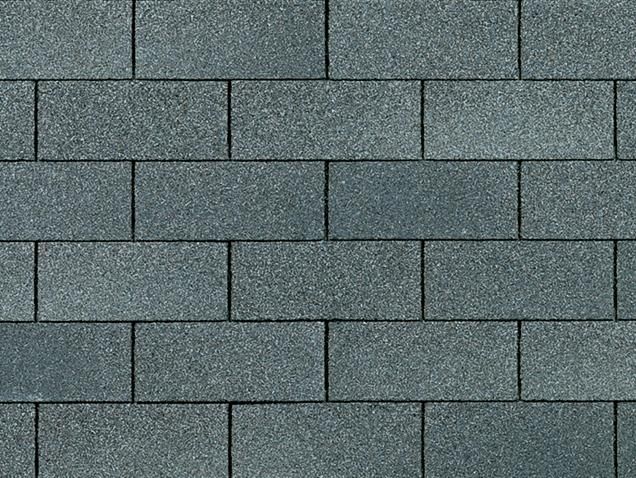 Gray asphalt roof shingles in a brick pattern.