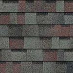 Roof shingles in a pattern of gray, brown, and red.