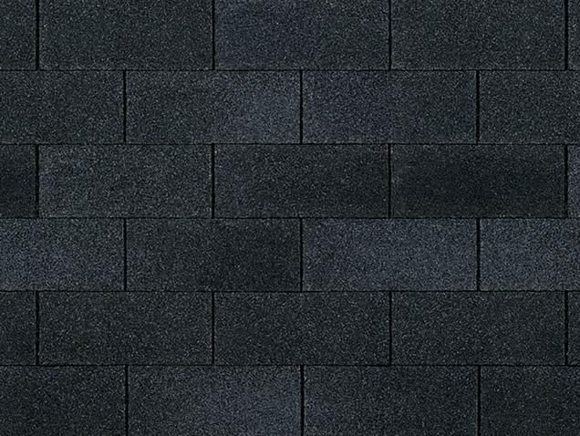 Dark gray asphalt roof shingles in a brick-like pattern.