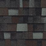 Close-up of a multi-toned asphalt shingle roof, various shades of gray, brown, and black.