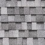 Gray asphalt roof shingles in a staggered pattern.
