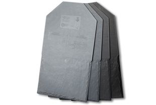 Stack of gray slate roofing tiles.