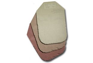 Body armor plates stacked, varying tan and pink colors.