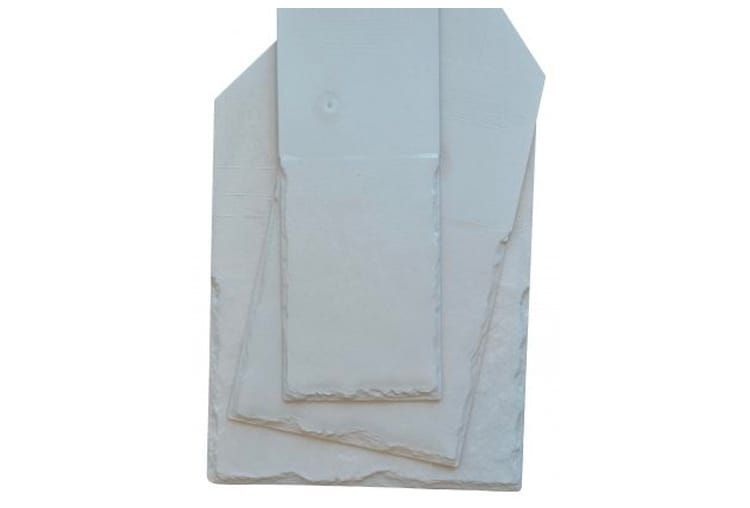 Three irregularly-shaped, pale gray slate tiles, stacked, with rough, natural edges.