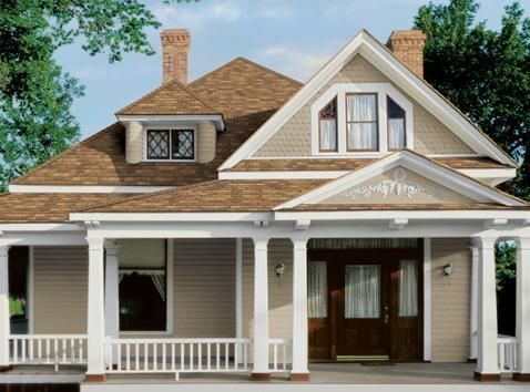 Tan house with a porch, gable roof, and brown front door.