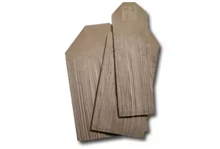 Three wood-like coffin-shaped pieces of material, possibly for a craft or model.