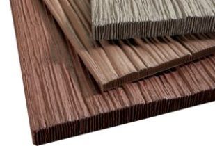 Close-up of layered, textured panels resembling wood grain in various shades of brown and gray.
