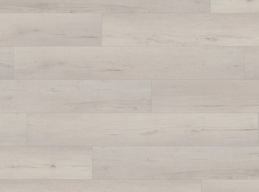 Light-colored, weathered wood flooring. Horizontal planks with varying grain and texture.