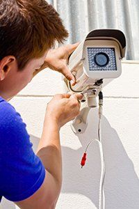 Man installing a video surveillance system